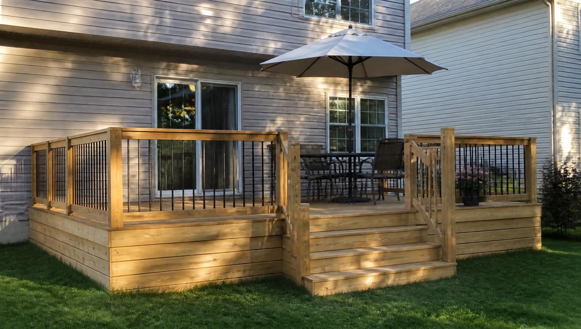 Newly built backyard deck with steps on a Central Iowa home
